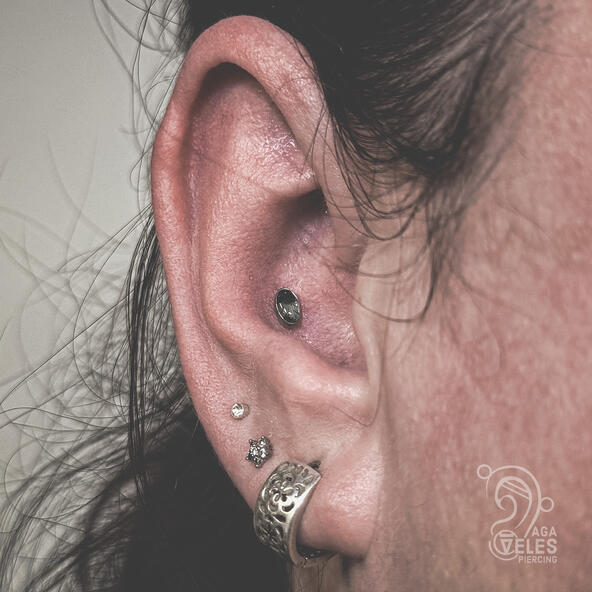 conch piercing with green moss agate top